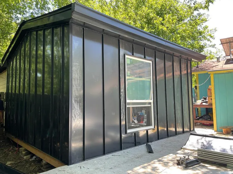 Black standing seam metal wall panels for Metal Roof Installation in Sioux City