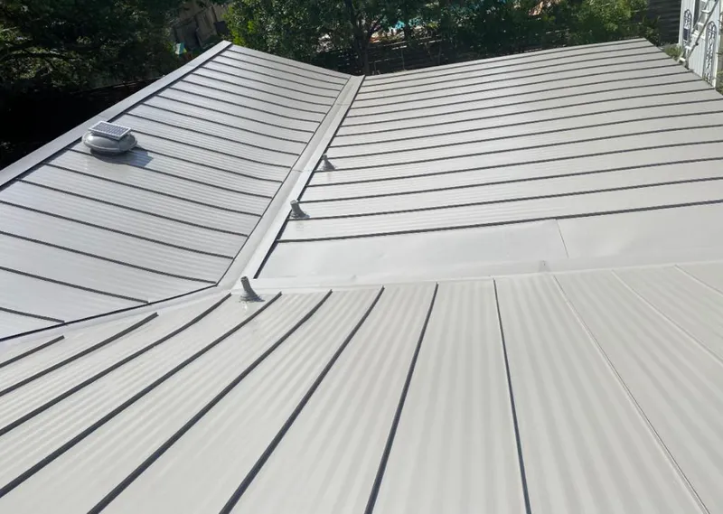 Solar attic fan installed on a metal roof for Roof Ventilation in Sioux City